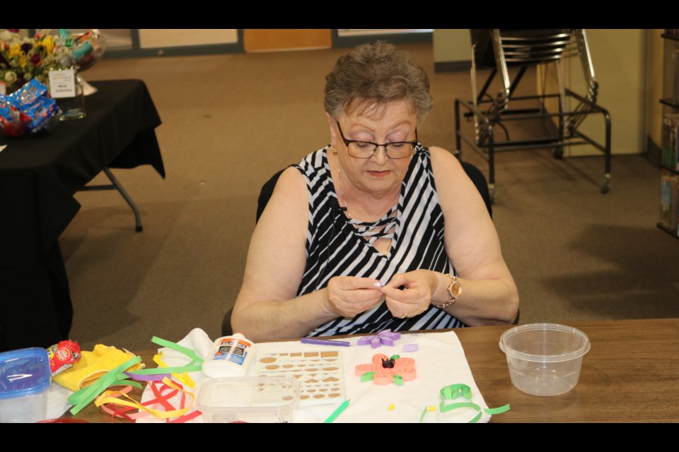 Judy Sawchuk demonstrates the technique of quilling.