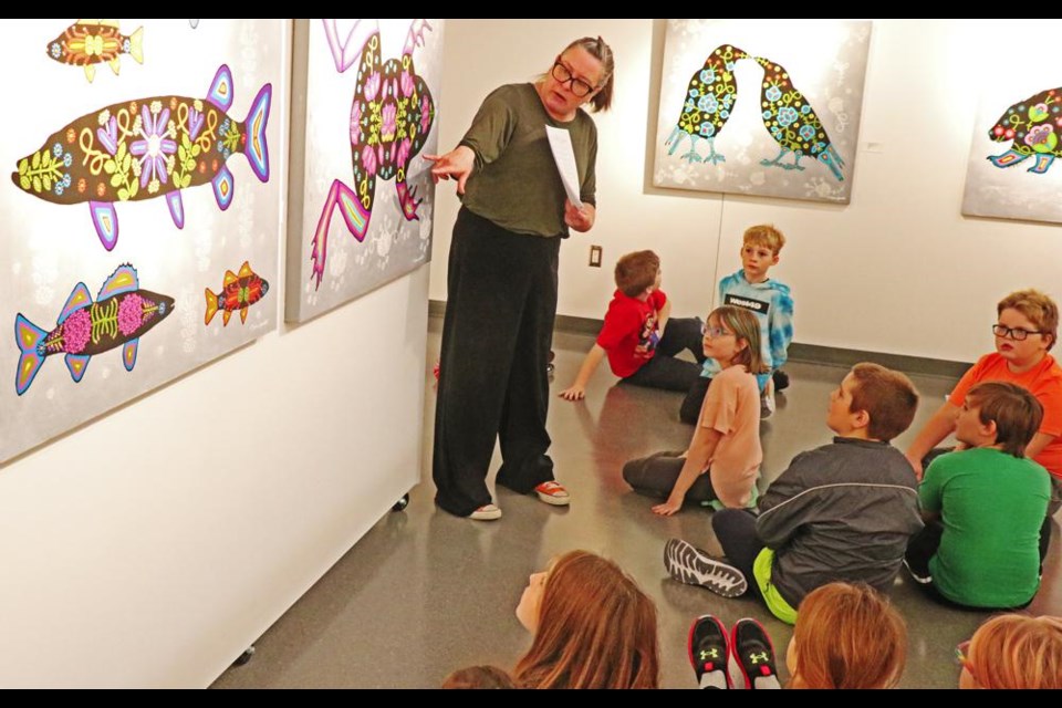 Curator Regan Lanning spoke about the works of Metis artist Phyllis Poitras-Jarrett, during a tour for Grade 4 students from Legacy Park school recently.