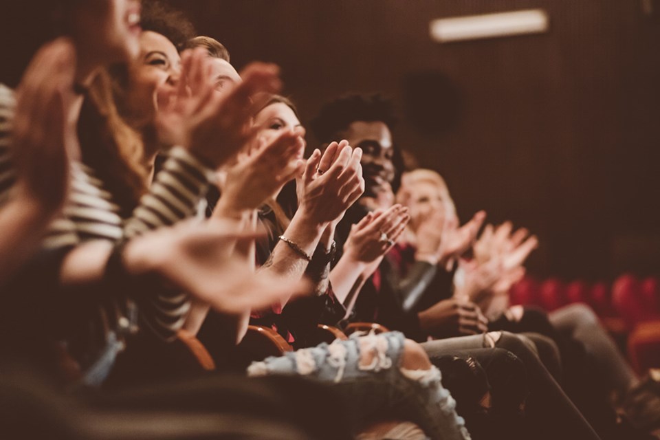 audience clapping hands