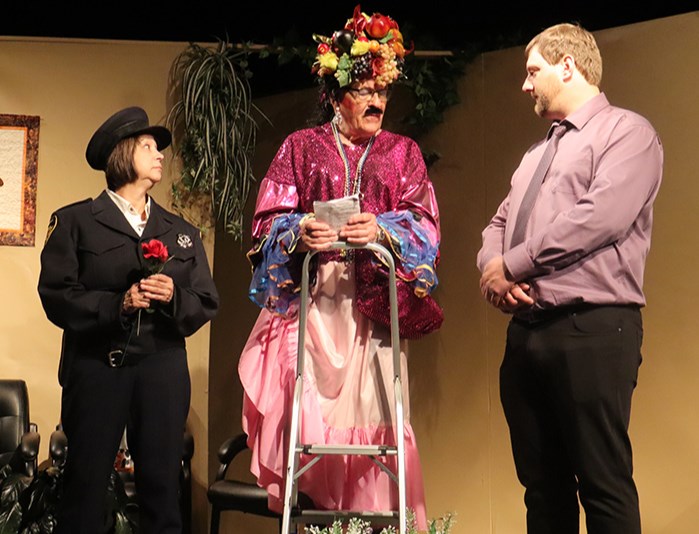The Buchanan Black Box Players Dinner Theatre production of Parloer Games hit the stage on April 24-26. Officiated by the outrageously dressed Judge Fahey (Ernie Kozak), who is in drag just to win a bet, Officer Kay (Betty Tomilin) and Dave (Steven Wyonzek) get married, all the while thinking they are standing in for Mort and Tricia’s renewal of their marriage vows, thanks to some brilliant and devious quick thinking by Tricia. 