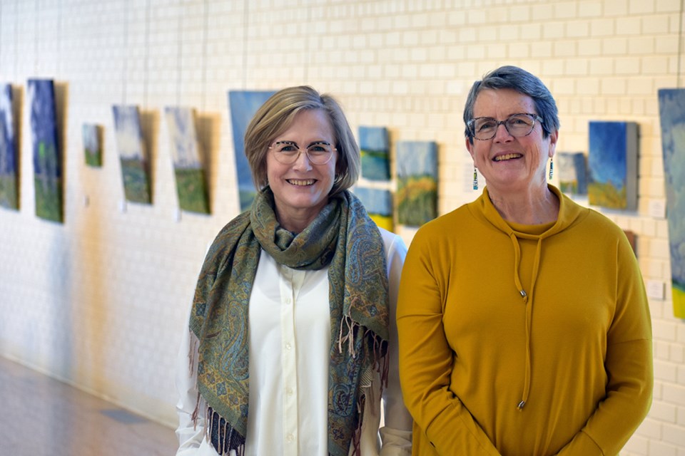 Artists and creators of Common Ground, Cindy Hoppe and Diane Larouche Ellard, pictured with a selection of their work on display at the Chapel Gallery.