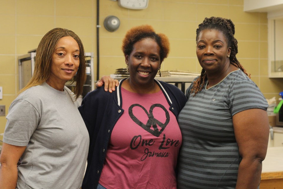 Deborah Samson, Taynika Walker and Pamela Bembridge of 306 Nyammings instructed a class of 13 people on how to make a traditional Jamaican dish in the first of Culture Days' Culture 365 series.