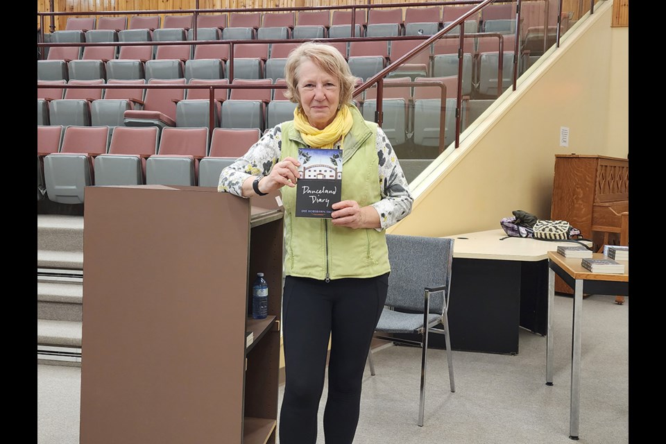 dee Hobsbawn-Smith poses with her debut novel, Danceland Diary.