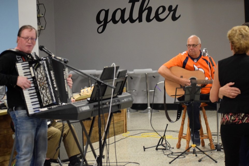 Jason Stepp, left, and David Kjersem played live music at the Make Music with Friends on Sunday at St. John the Baptist Roman Catholic Church. 