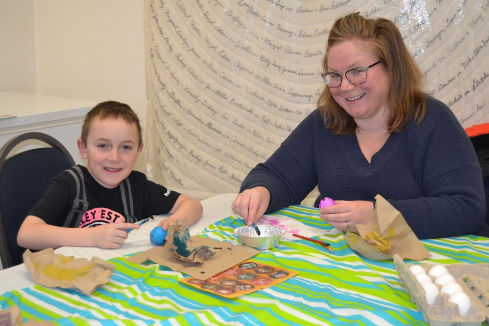 Nicholas Chalupiak, left, and his mom Lecia learned how to decorate and dry Ukrainian Easter eggs at a workshop held in Preeceville.
