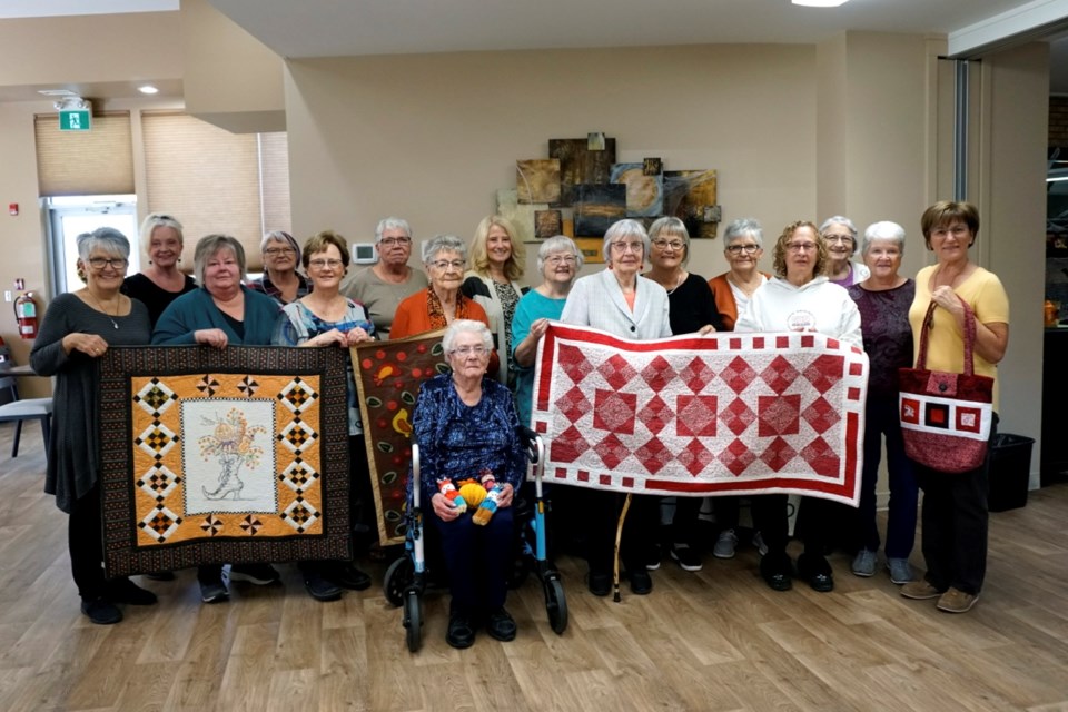 Members of the Hearts and Hands Quilters Guild were at Creighton Lodge Saturday celebrating their 20th anniversary. Pictured here are, from left, Eleanor Hirsch, Shirley Peterson, Mona Dukart, Clara Freitag, Marg Mantei, Rose Van De Woestyne, Patrice Hoffas, Marion Macmillan, Nancy Shirley, Linda Jones, Eileen McKersie, Marlyn Wock, Joyce Beggs, Avis Dronsfield, Colleen Schindel and Sara Harder (sitting in the front).                       