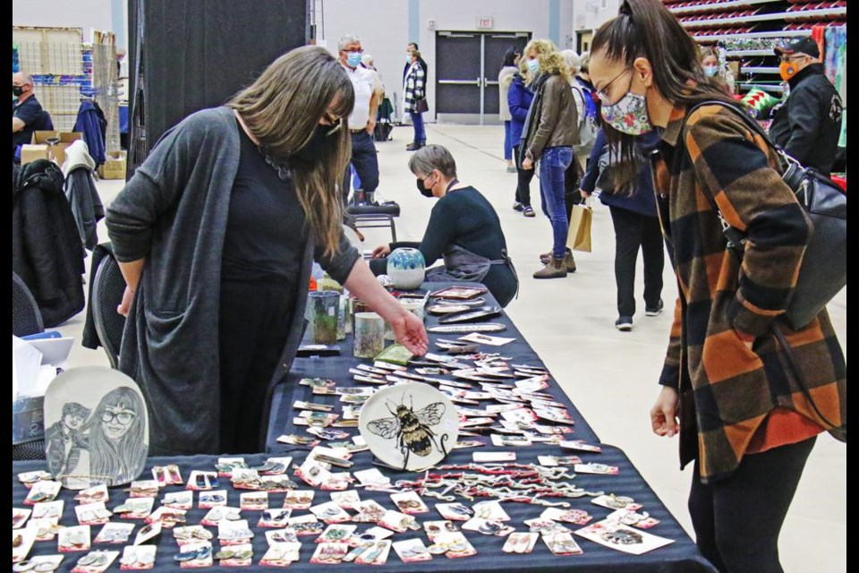 Artist Regan Lanning of Aftermath Ceramics showed her ceramic works, ranging from earrings to vases and incense holders, at the "Gifted" winter art market on Saturday.