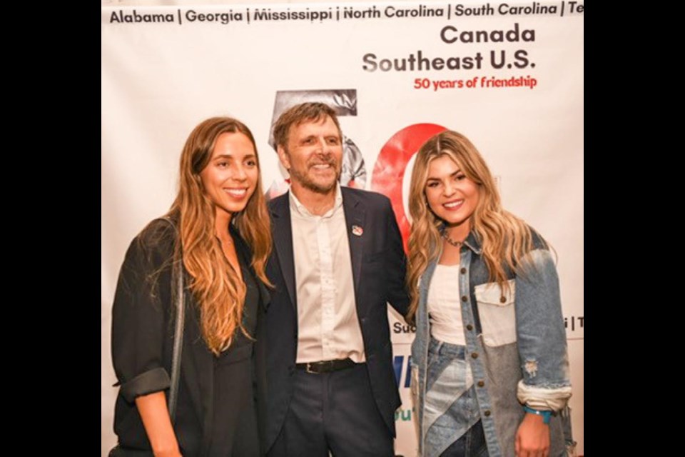 Diplomat James Hill, centre, the Consul General in Atlanta, Ga., is with Brooklyn and Tenille Arts, as Tenille performed at a celebration of 50 years of Canada having a presence in the U.S. 鶹Ƶeast region.
