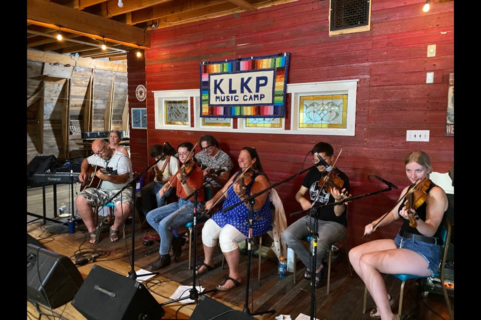 Musicians playing to a good audience at the Red Market Barn on July 14.