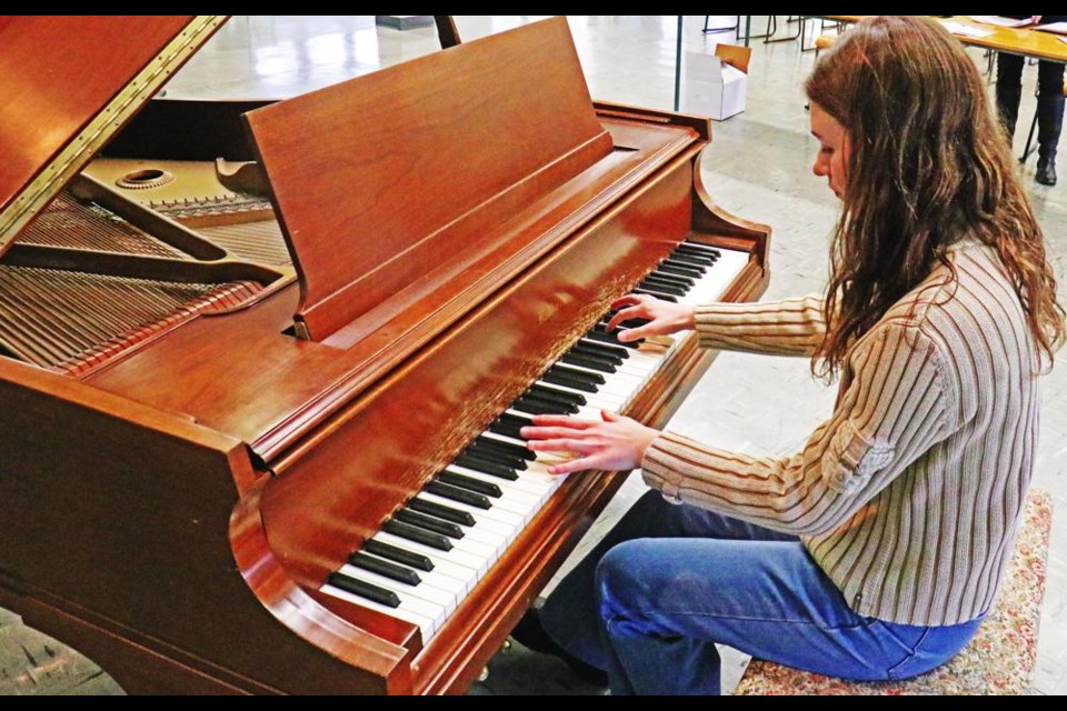 Lindsay Van De Weyer practiced one of her festival pieces on the piano at the Grace United Church. This was June Barber's piano, and will be available for the piano entrants at the Music Festival