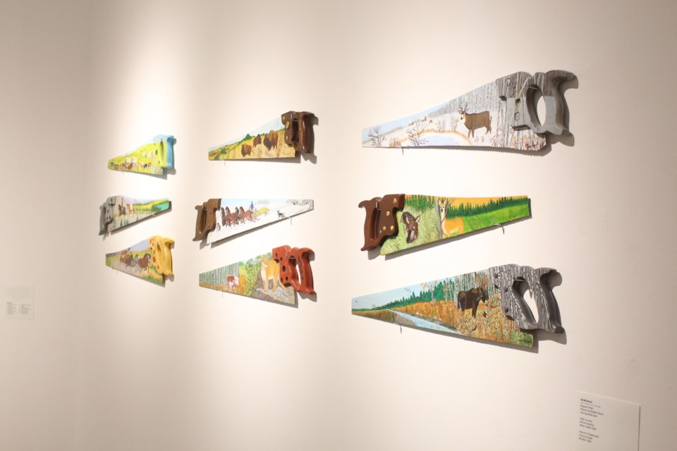 Morhart uses old wood saws as a unique medium for his paintings.