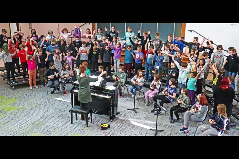 Music teacher Holly Butz led the Grade 5 choir in "Song of Peace" at Legacy Park, in preparation for performing at the Weyburn Music Festival on March 15