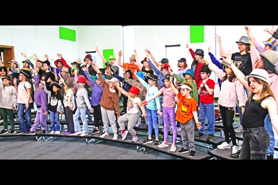 The Legacy Park Choir, led by music teacher Holly Butz, rehearsed a song from the musical "Annie", at noon on Friday.