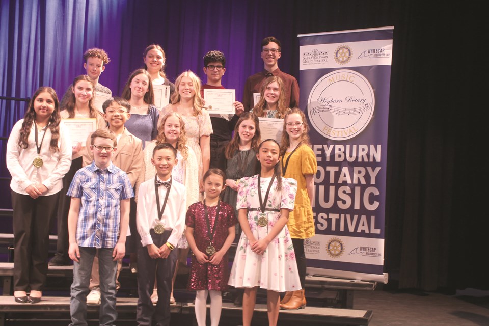 Winners of piano awards from the Rotary Festival of Music gathered at the Cugnet Centre. In the back row, from left, are Ben Sawatsky, Felicia Deal, Ben Jebelli and Judah Sawatsky. In the third row, from left, are Camilla Renkas, Sydnee Thiessen, Grace Anderson and Lily Penner. In the second row, from left, are Atrisa Farhadi, Bentley Bahingawan, Grace Hall, Heidi Penner and Lydia Sawatsky. In the front row, from left, are Nathan Cornish, Alexander Dela Cruz, Ava Dela Cruz, and Alexandra Jose.