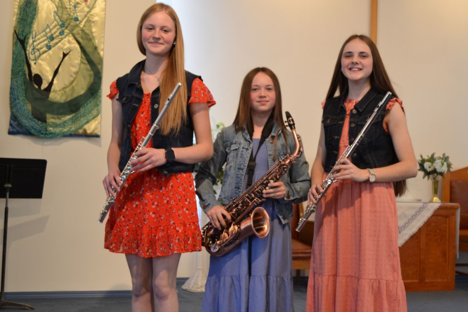 Performing a family musical selection from left, were: Abby Scheller, Kyla Scheller and Maicey Scheller of Preeceville. 