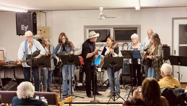 I Shall Be Released, written by Bob Dylan, was performed by all the musicians to ‘send Leary off’. From left: Ashanti Fraser, Sarah Fleury, Carolyn McDonald (Popescul), Greg Dandeneau, Flint McGonigal on drums (hidden behind Greg Dandeneau), Gina Stewart, Sue Rayner, Marty Harden, and Marie Lerminiaux.