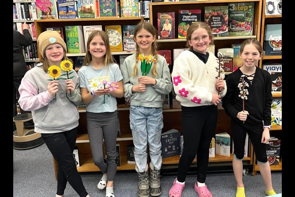 Cutline 2: From left, Hadley Wallace, Mila Simpson, Aidyn Junk, Emmalia Ball and Jayda Morrow enjoyed making flowers out of Lego at the Oxbow Public Library. 
