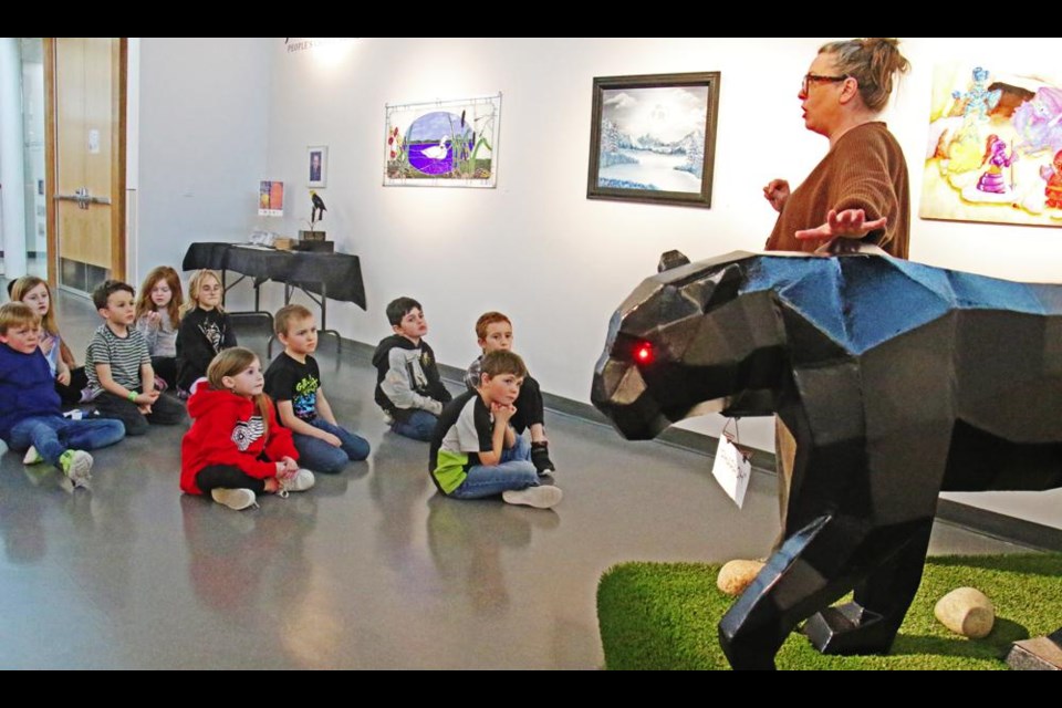 Curator Regan Lanning talked about this steel sculpture of a black panther, with a Grade 2 class from Legacy Park during a tour Wednesday of the James Weir People's Choice exhibition.