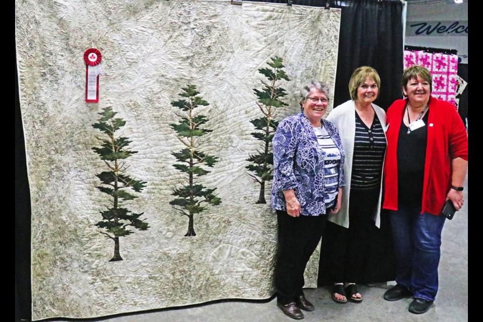 This quilt was the people's choice favourite for the Crocus Quilters show on Friday and Saturday, made by Shirley Mathieson (centre), flanked by show organizers Marg Stewart and Jill Thorn