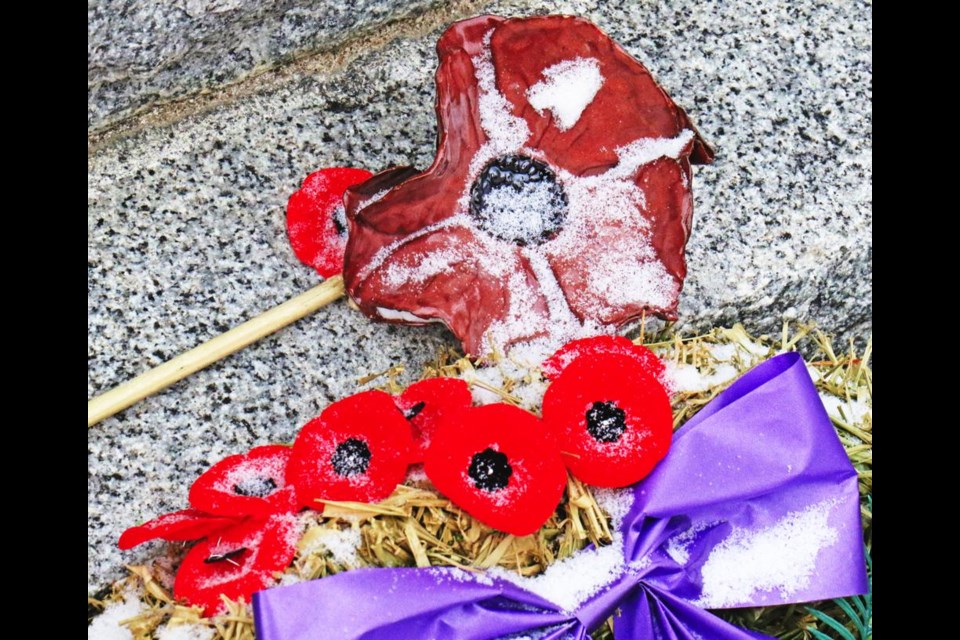 Poppies laid at a community site in remembrance.