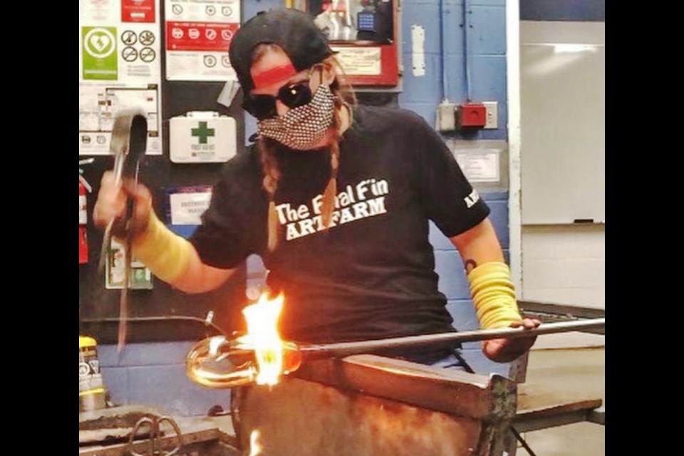 Working with molten glass can be very hot work, says Rickee-Lee Webster, taking her fine arts degree