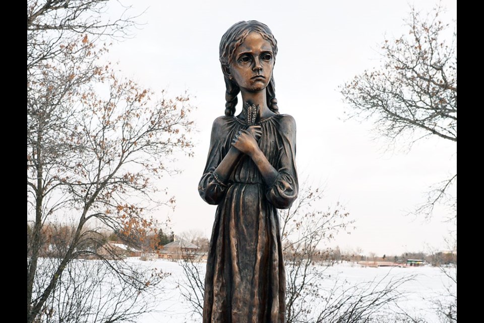 The statue commemorating Holodomor, a copy of Petro Drozdowksy’s "Bitter Memories of Childhood," stand in Wascana Park in Regina.