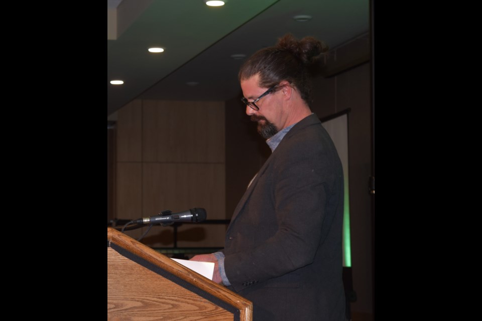 Veteran film maker Shayne Metcalfe prepares to announce the Best Picture (Overall) winner during last Saturday's Saskatchewan International Film Festival awards night at TCU Place.