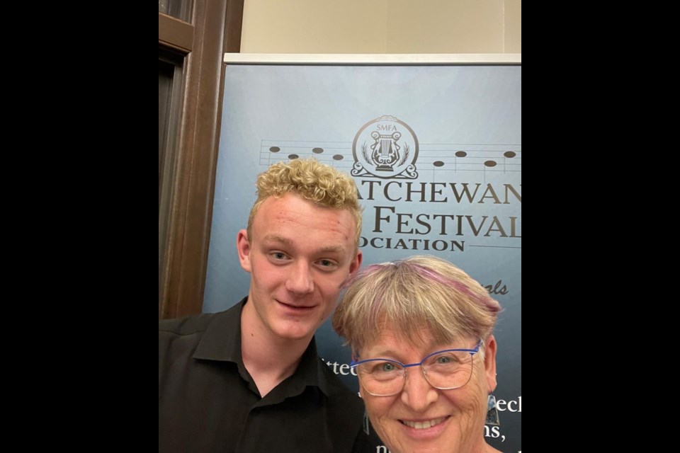 Steyn Hoogstad poses here with Heather Macnab, donor of the Bircham Scholarship, won at the 2023 provincial music festival.