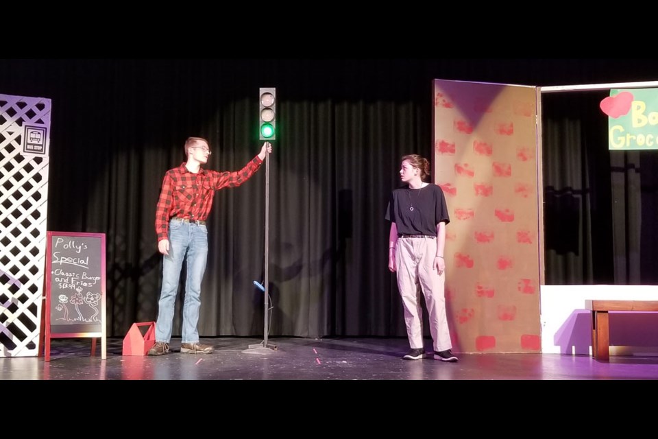 Lex Olesen as Tom and Carter Mutch as Bob, argue about the necessity of a stoplight in UCHS Drama production, 'One Stoplight Town'.