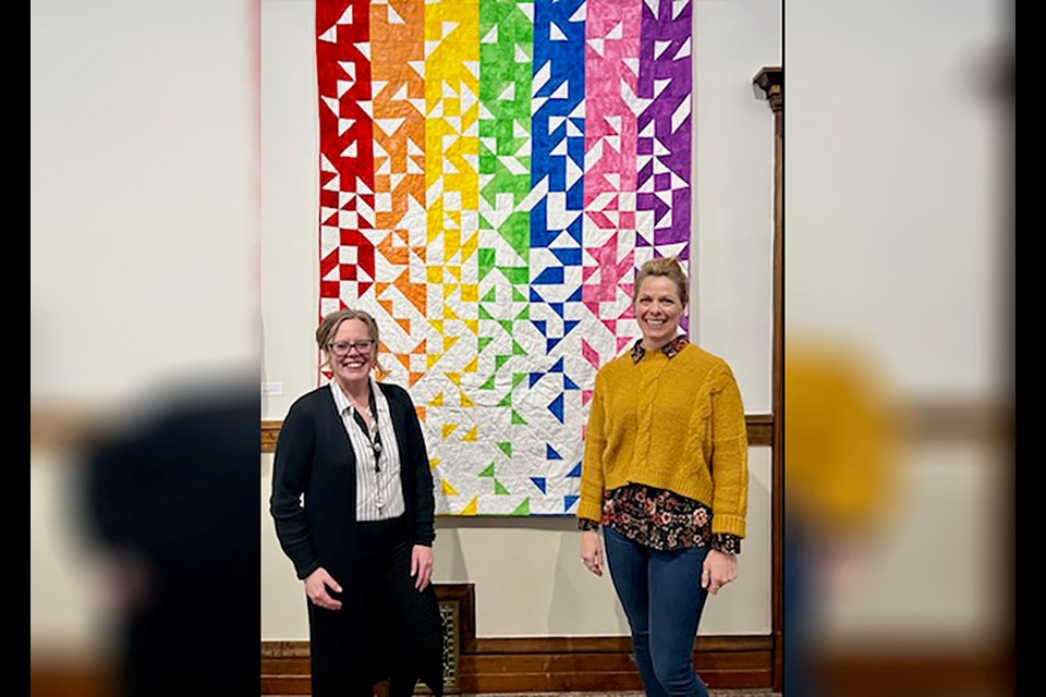 Tracey Cholin, chairperson of Kerrobert Courtroom Gallery, stands with Leanne Kohlman at the closing reception of Leanne's quilt display.