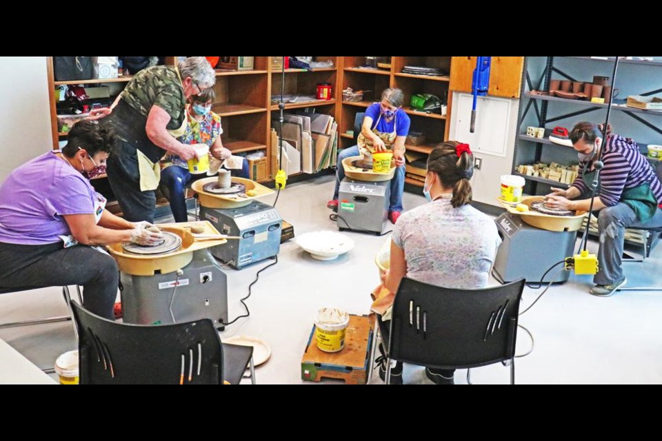 Students in a class on wheel-throwing learned the basics of creating pottery on a wheel on Saturday