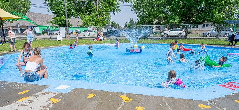 The Battleford Tot Lot was very busy on this hot day. Local area children as well as children from a local North Battleford school were cooling off in the water. The playground equipment was also a popular area.