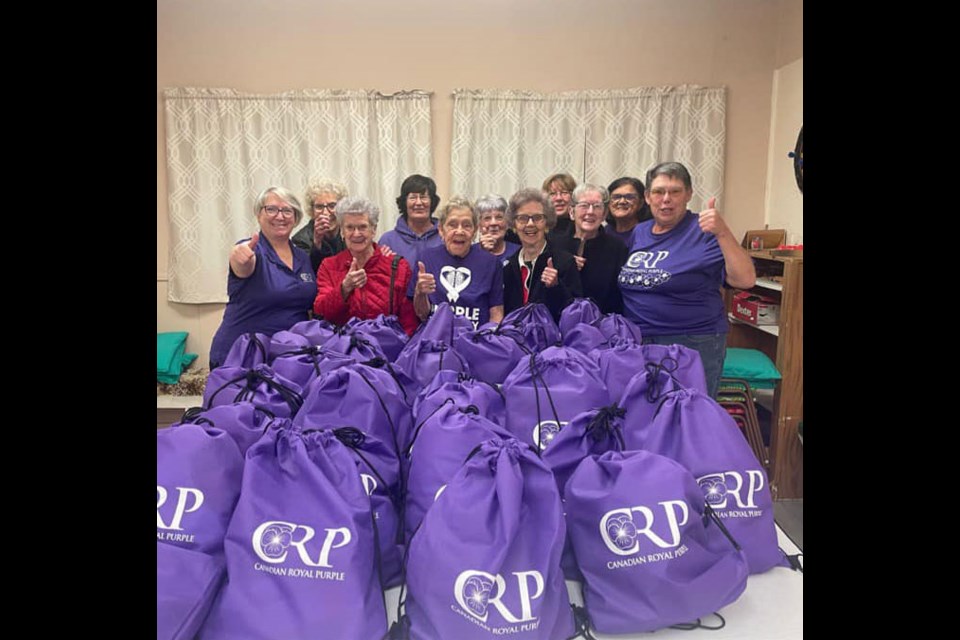 The Cut Knife Royal Purple ladies show off their hard work of creating 50 bags that were donated to a local women’s shelter.