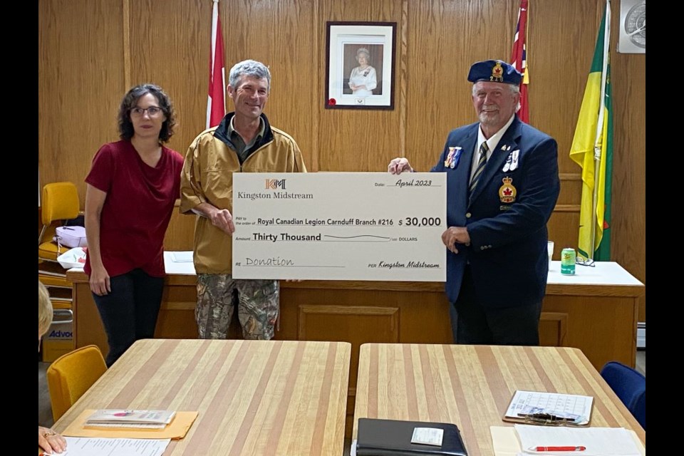 Pictured are, from left, Dena Bachorcik and Richard Kirby with Kingston Midstream and Carnduff legion president Jeff Young.