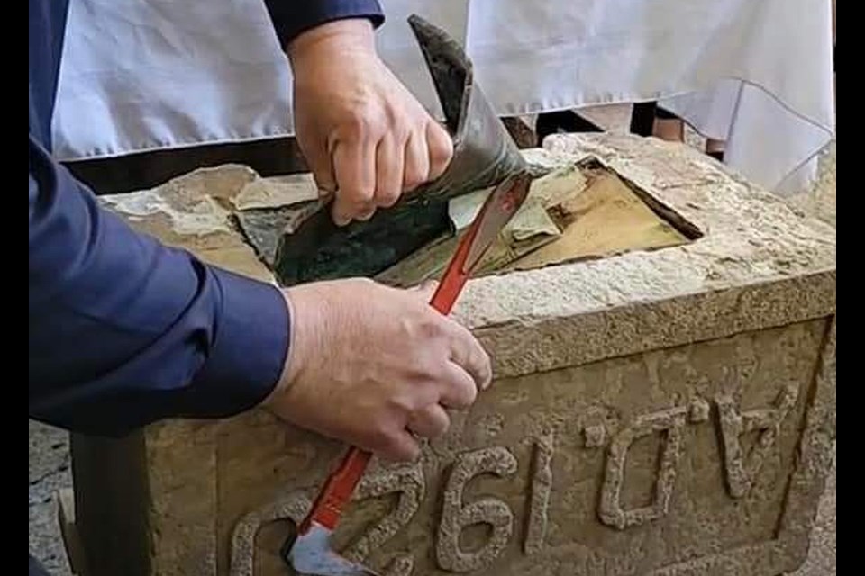 Kerrobert Mayor Wayne Mock, was put in charge of the delicate task of opening the newly discovered time capsule at the historic Kerrobert Courthouse.