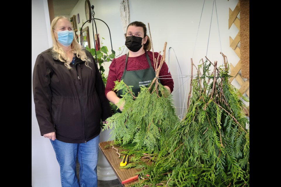 Chris Martin and Krystle Martin, museum members, were part of the assembly team preparing for the second live-green gnome fundraiser benefitting Unity's museum.