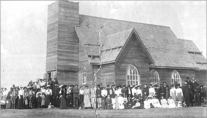 Ste. Anne’s Church and congregation while still under construction in 1906.