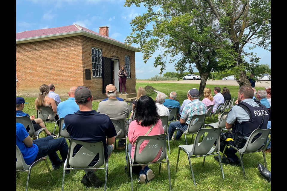 Attendees take in the words of current Saskatchewan Land Surveyors Association president Heather Maloney.