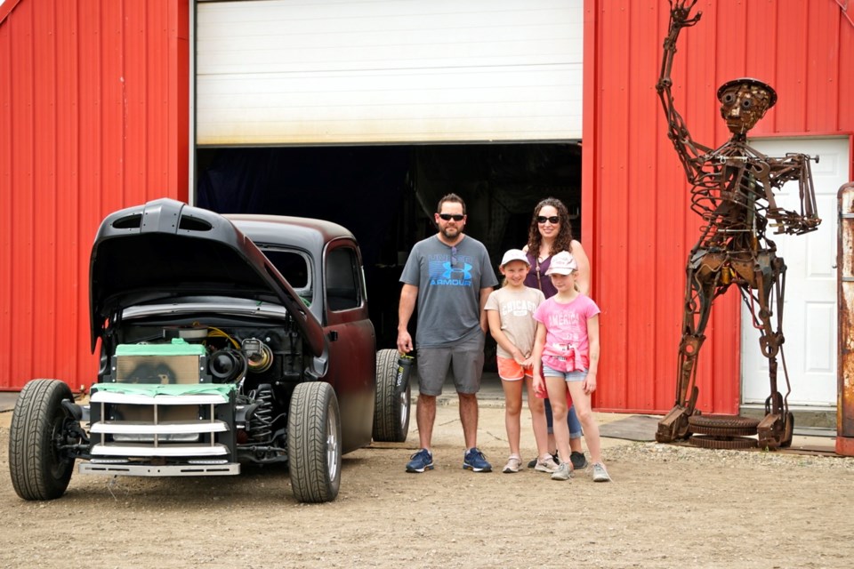 Joe, Kara and Haily Threinen along with Charlie Pyra were exploring the T&T Rods Show and Shine exhibition.                               