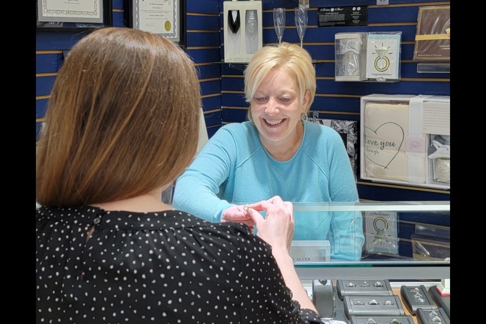 Laurel Buck talks with a customer at A&A Jewellery & Gifts. The long-time Estevan business is celebrating its 50th anniversary this month. 