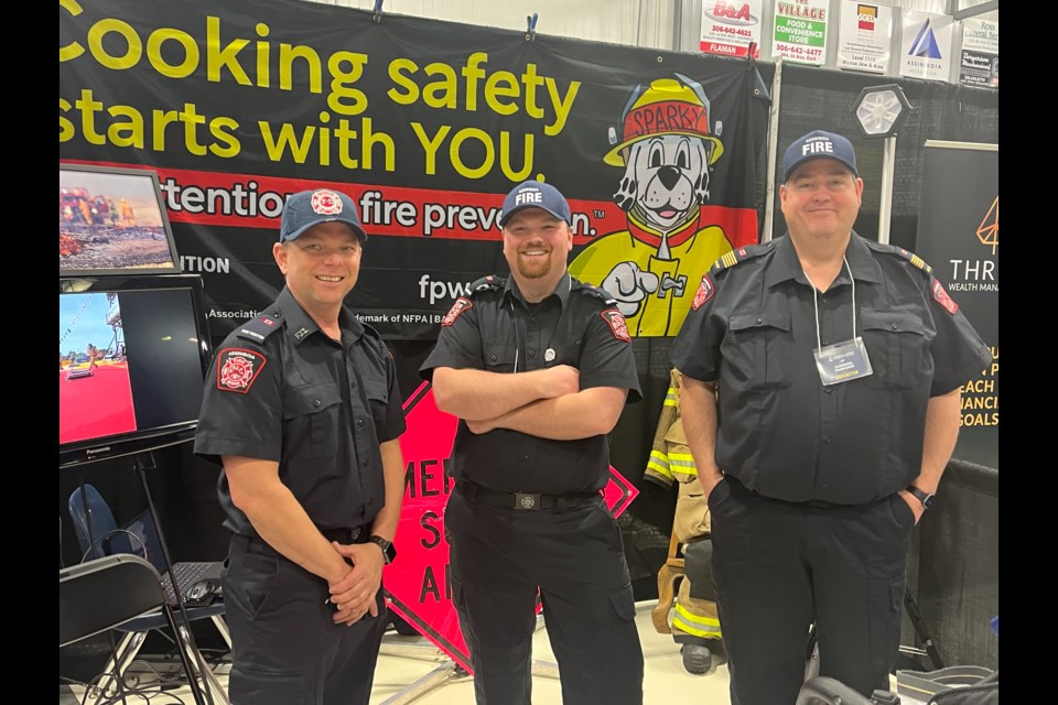 Members of the Assiniboia Fire Department attend the Chamber of Commerce Trade Show held at the Prince of Wales on May 3 and 4. From left are Mike Kraus, Cody Waselenka and Terry Lacelle.