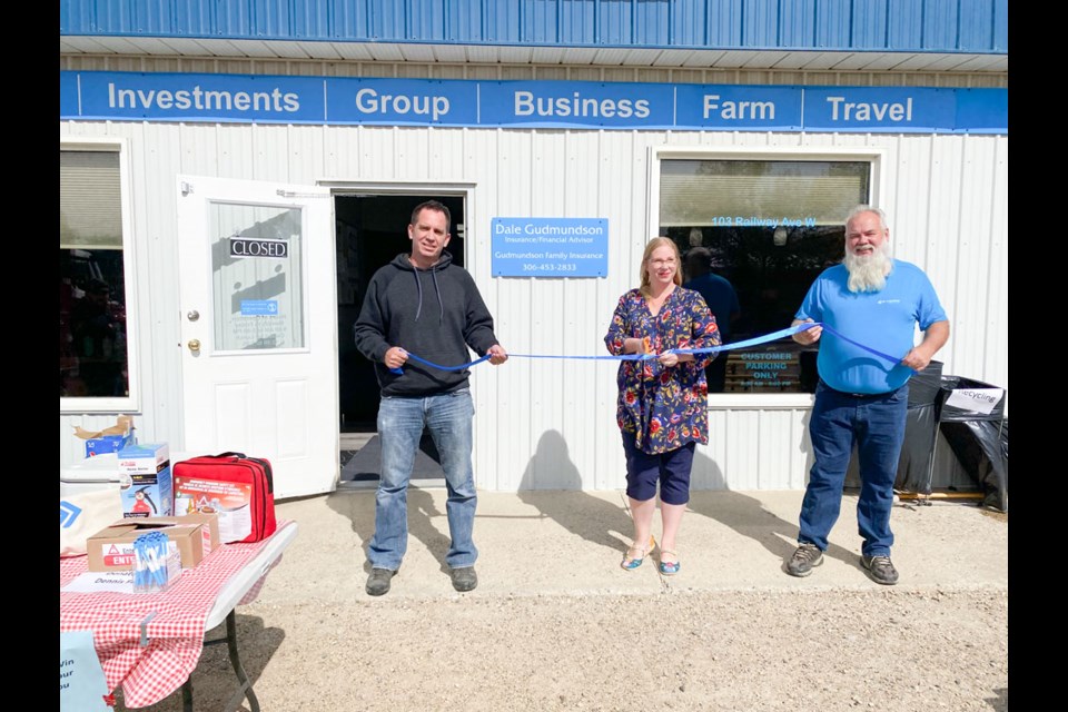 From left, building owner Jared Riddell, Carlyle Mayor Jennifer Sedor and businessman Dale Gudmundson at the grand opening.
