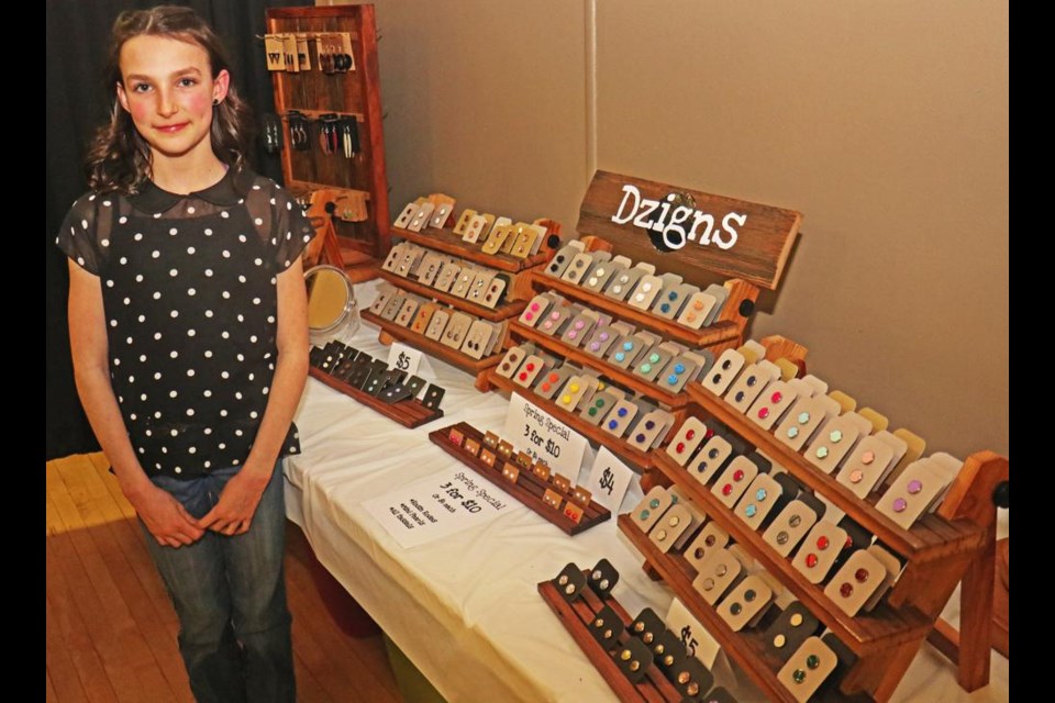 Kamryn Doud showed off her display of earrings that she designed and made, while attending the Weyburn Chamber of Commerce's President's Dinner and AGM on Wednesday night