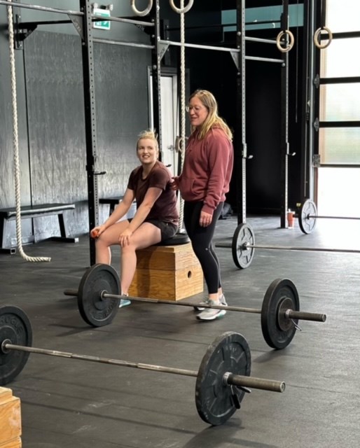 Fitness Lair Coach and Physiotherapist, Jenna Poleris, works with fellow coach, Sara Brown, on setting up exercises for a new class being offered called 'Fit for Function'.