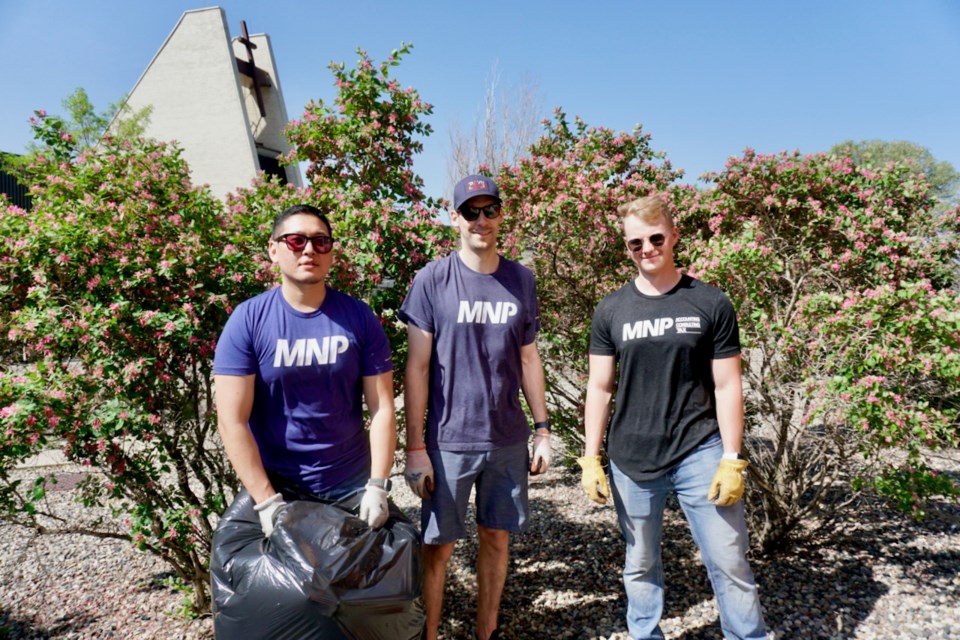 On the Day of Caring, Ryan Lim, Daryl Donovan and Leighton Mus with MNP were working in the Trinity Tower yard.                               