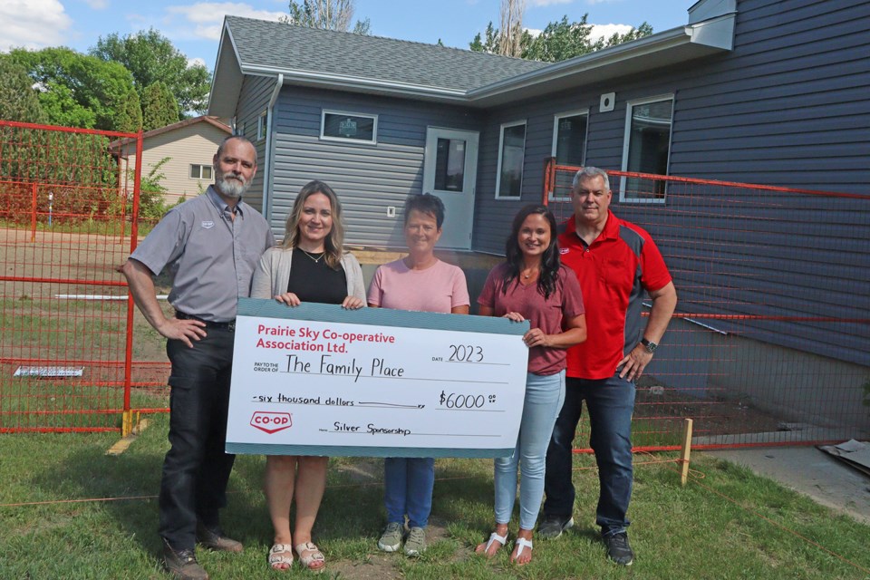 Prairie Sky Co-op is recognized as a silver sponsor to the new location of the Family Place, with a commitment of $30,000 to the project. This $6,000 donation was the first of five installments. From left are Ken Helfrick, home décor supervisor for Prairie Sky Co-op; Danielle Knoll, member relations manager for Prairie Sky Co-op; Judy Lumb and Dawn Gutzke, Family Place; and Trent Schnell, building materials supervisor for Prairie Sky Co-op.
