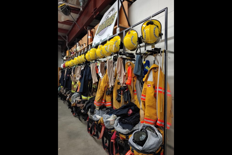 Fire fighting protective gear hangs ready, in case of an emergency, at the Assiniboia Fire Department.