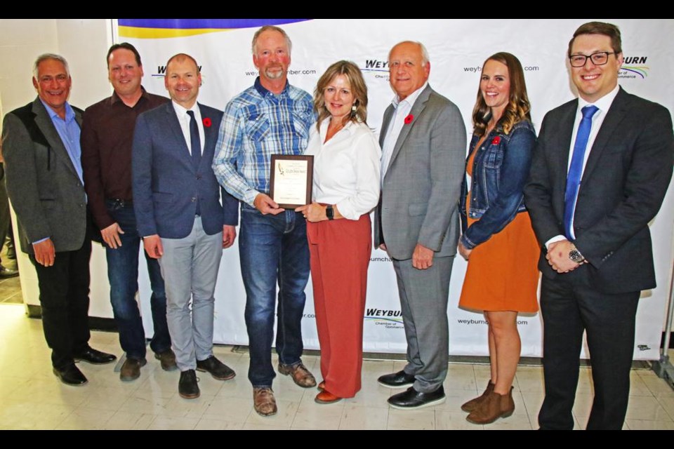 The recipients of the Golden Sheaf Award by the Weyburn Chamber of Commerce gathered with local government and chamber representatives on Tuesday night at McKenna Hall. From left are Mayor Marcel Roy, Reeve Norm McFadden, Weyburn-Big Muddy MLA Dustin Duncan, Golden Sheaf winners Alan and Yvonne Whitrow of 鶹ýAVampton Farm, Agriculture minister David Marit, Chamber executive director Monica Osborne, and Chamber president Stephen Schuck.