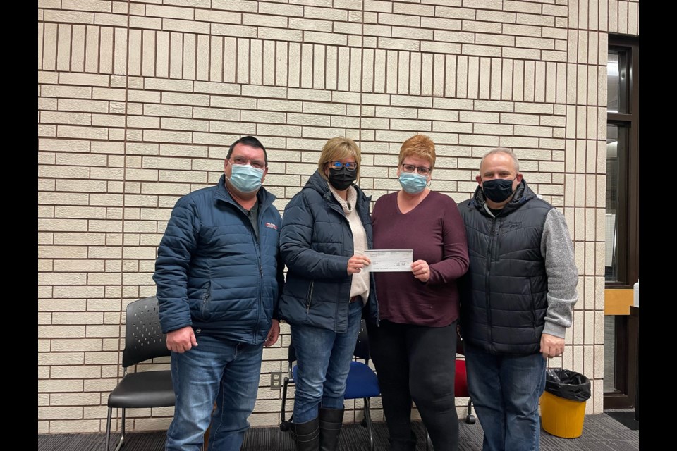 Mayor Sharon Schauenberg presents the Planning Committee for the Viterra Scotties Curling Championship with a donation from the Town of Assiniboia. Council extended appreciation for all the work and time spent organizing the event.  From left are Rob Greensides, Cheri Blackwell, Mayor Sharon Schauenberg, and Mike Broda.