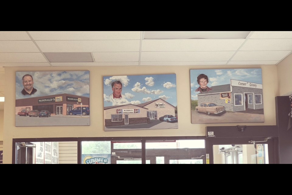 Three paintings commissioned by Sharon Strand placed on the wall above the vestibule at the front of the store depict three generations and three locations of McDonald’s Family Foods. They were given to Glynn McDonald as a Christmas present from his staff a few years ago.